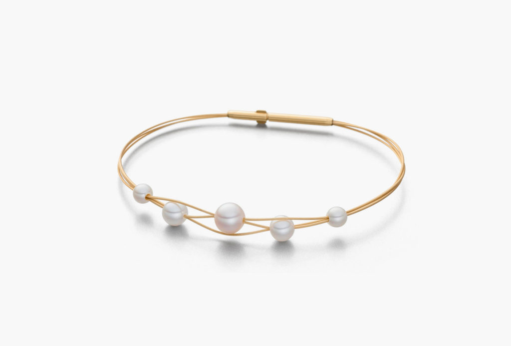<em>Tau</em> [dew] bracelets. Freshwater pearls, gold-plated steel.