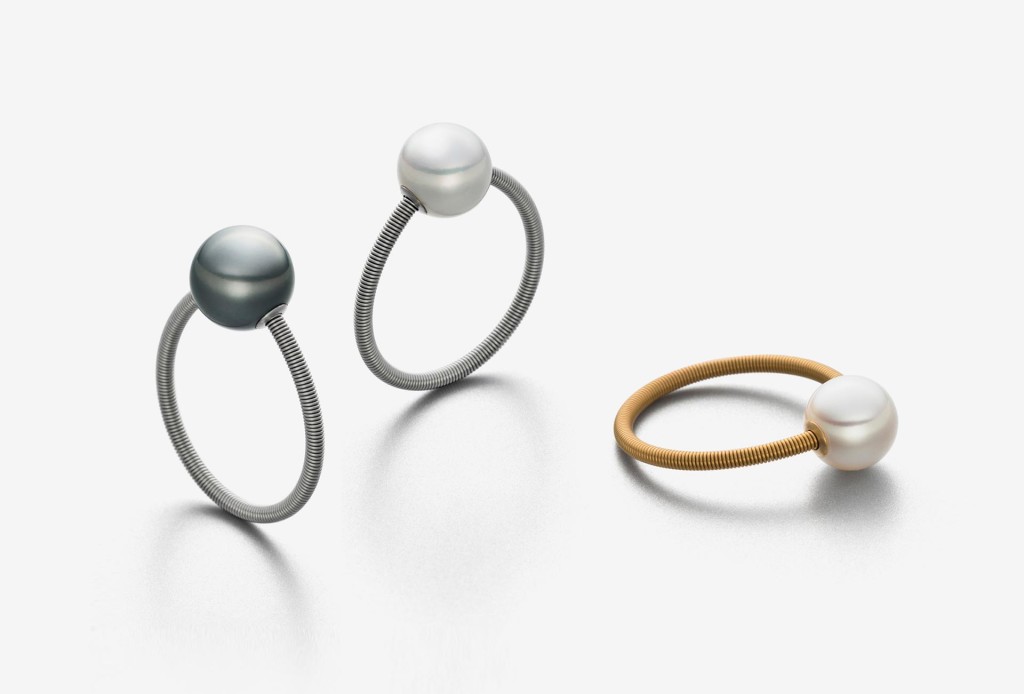 <em>one</em> rings. Stainless steel, partly gold-plated, freshwater pearls, Tahitian pearls.