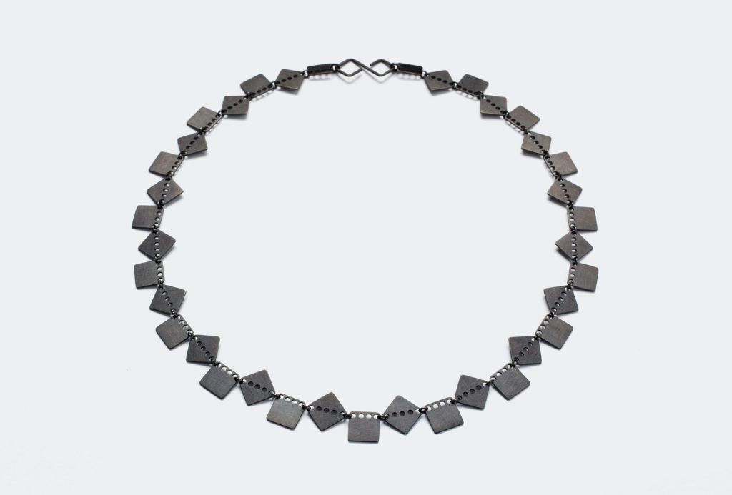 <em>inpuncto karo</em> necklace, 2020. Silver 925, black rhodium-plated. Photo Mirei Takeuchi.