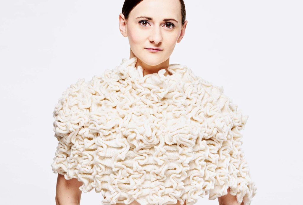 <em>AIRELLE</em>, 2018, pelerine knitted white. 70% merino extrafine, 20% silk, 10% cashmere, width 65cm, height 40cm. Photo: Ingo Misiak Photo Professional.