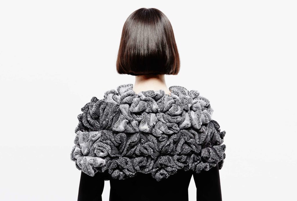 <em>KENKO</em>, black and white, 2016, knit cape. 75% merino extrafine, 25% silk, width 60cm, height 40cm. Photo: Ingo Misiak.