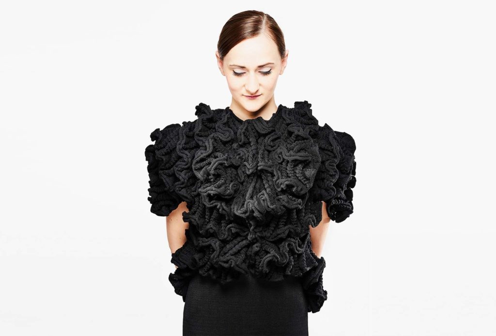 <em>TILIA</em>, 2018, jacket knitted black. 95% merino extrafine, 5% elastane, width 70cm, height 50cm. Photo: Ingo Misiak Photo Professional.