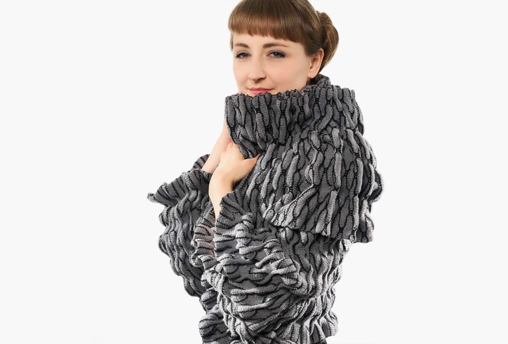 <em>SÄDE</em>, jacket gray and black, 2019, knitted. 95% merino extrafine, 5% silk, height 80cm, width 120cm. Photo Ingo Misiak.