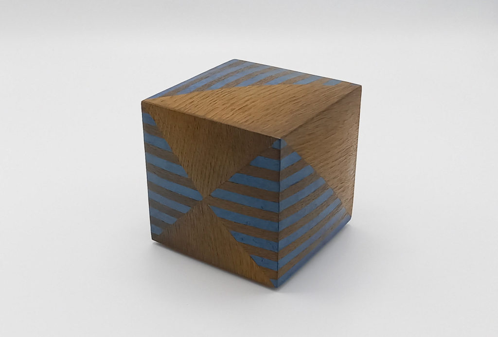 Spherical cube with inlays, blue colored sycamore and bog oak. W 13 x L 13 x H 13 cm.