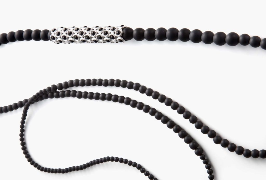 Long chains from the series  <em>Aufgereiht</em> [lined up]. Onyx combined with silver.