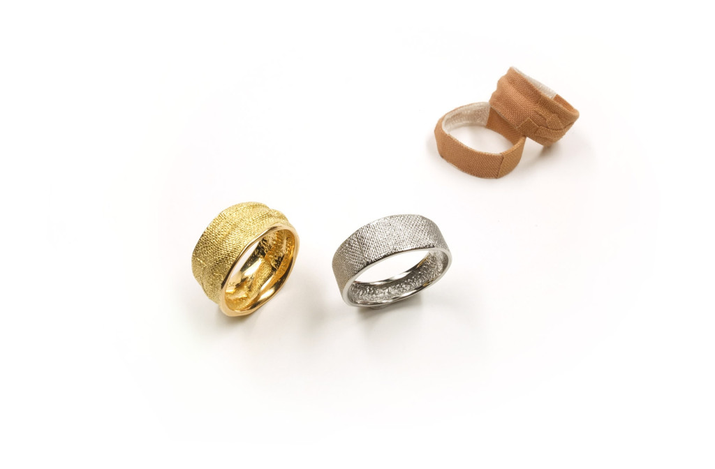 Two worn and two shortly worn <em>Pflasterringe</em> [plaster rings], 2014. Plaster respectively 750 yellow gold, stainless steel. Stainless steel 407 €, yellow gold depending on width and size ca. 1000–1600 €. 