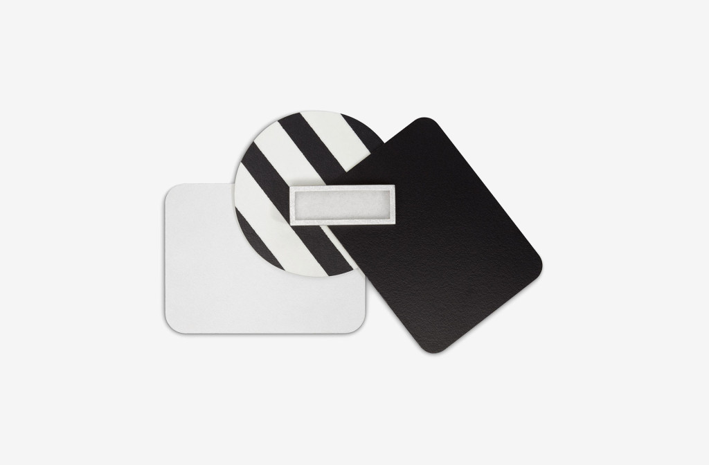Brooch from the collection <em>laminati mille colori</em>. Composition black-white. Laminate, silver, felt