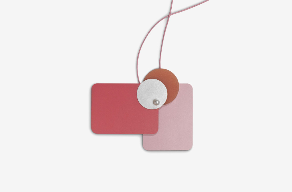 Pendant from the collection <em>laminati mille colori</em>. Composition rose-salmon. Silver, laminate, fresh water pearls