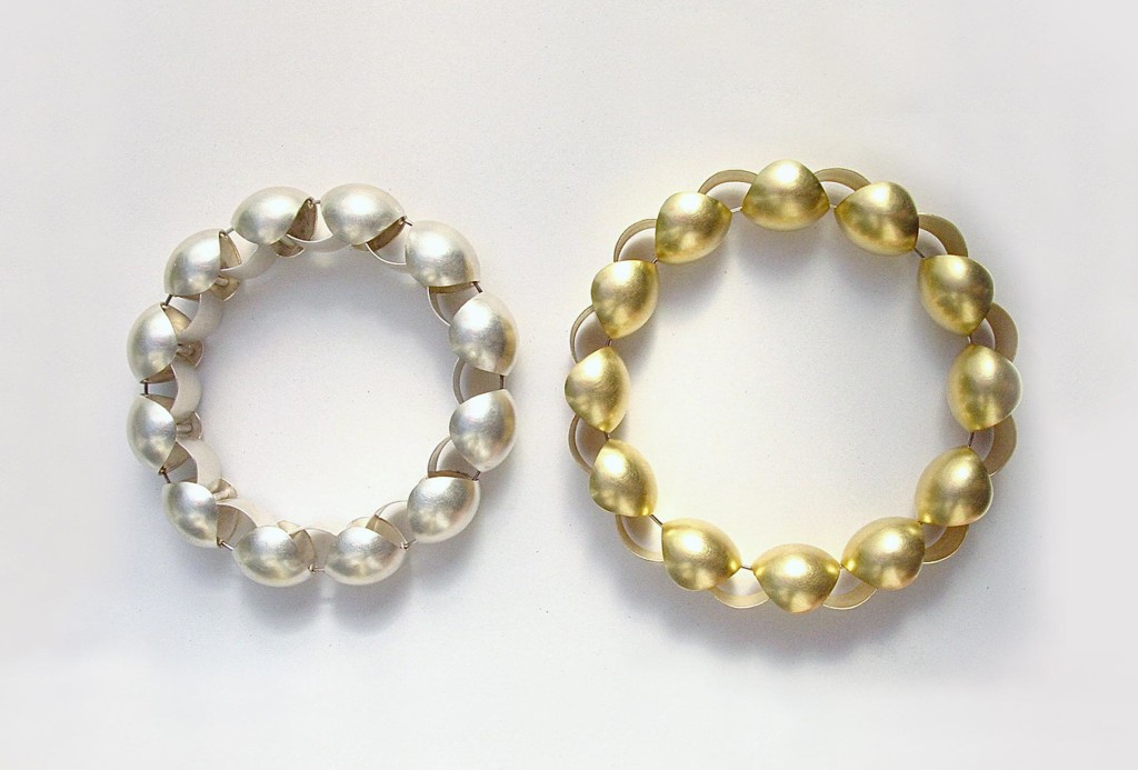<em>Turnus</em> bracelets. Silver 925, gold 750, stainless steel wire.