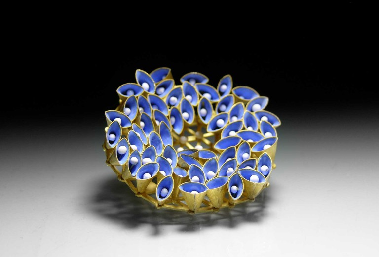 12.-Ryan.-Brooch-with-moveable-cones.-2009.-18ct-and-vitreous-enamel.-50-x-50-x-10mm.