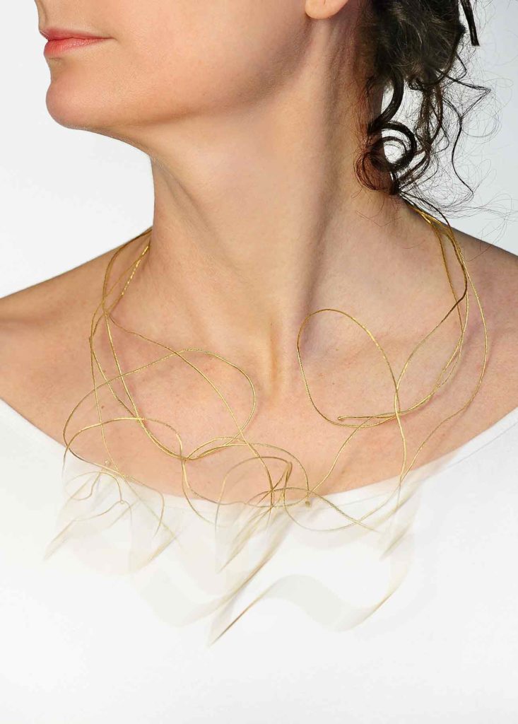 <em>Flows</em> necklace, 2010, series <em>The Great River</em>. Gold 750, elastic threads, 50 x 30 x 5 cm