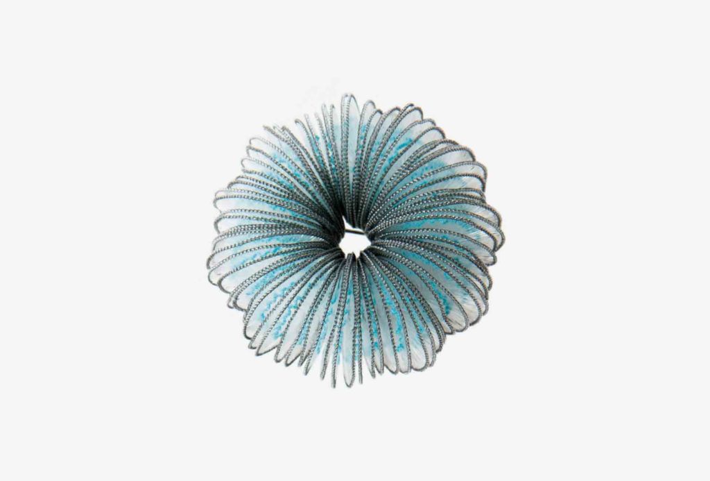 <em>Rise</em> brooch. Nylon, cotton, silver 925. © Anke Hennig Jewellery