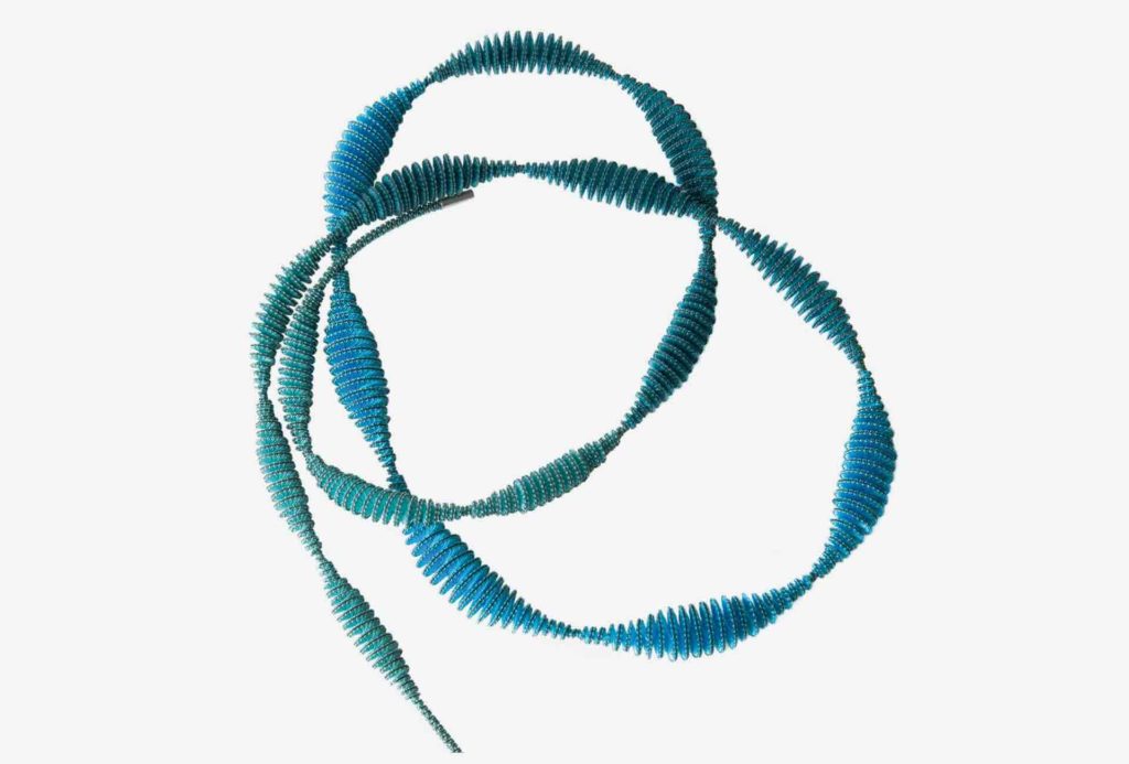 <em>Rise necklace XVII</em> with shape and color gradient. Cotton, rayon, nylon, silver 925. © Anke Hennig Jewellery