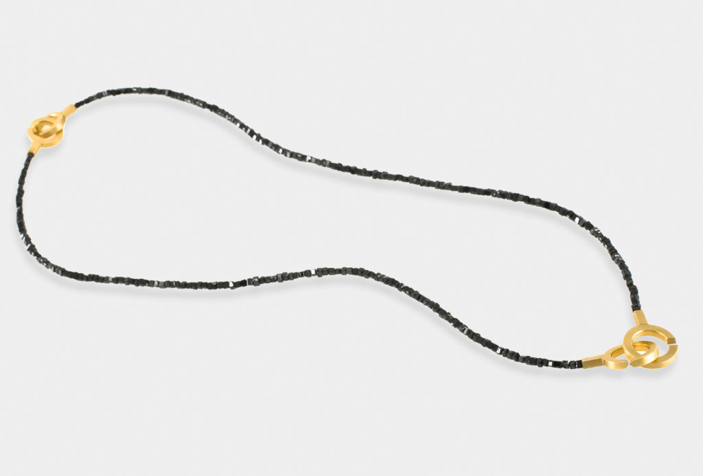 <em>Dia</em> necklace from the collection <em>Circle Line</em>. Gold 750, black diamonds.