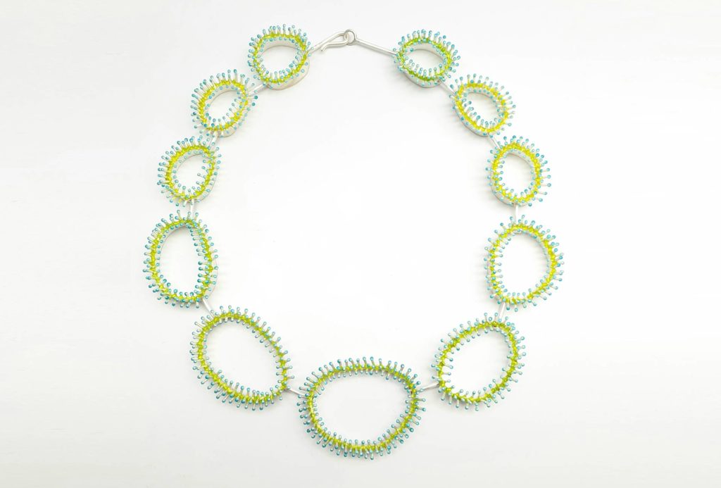 Necklace from the series <em>Blumentiere</em> [Flower Animals]. Silver, yellow-blue enamel.
