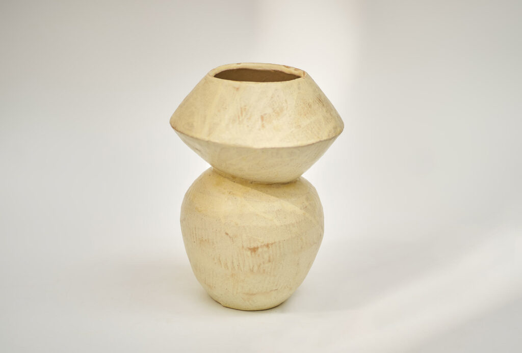 <em>Dancing Edge</em> vase from the <em>Figures</em> series, 2024. Glazed stoneware, yellow. 17 x 16 x 23.5 cm.