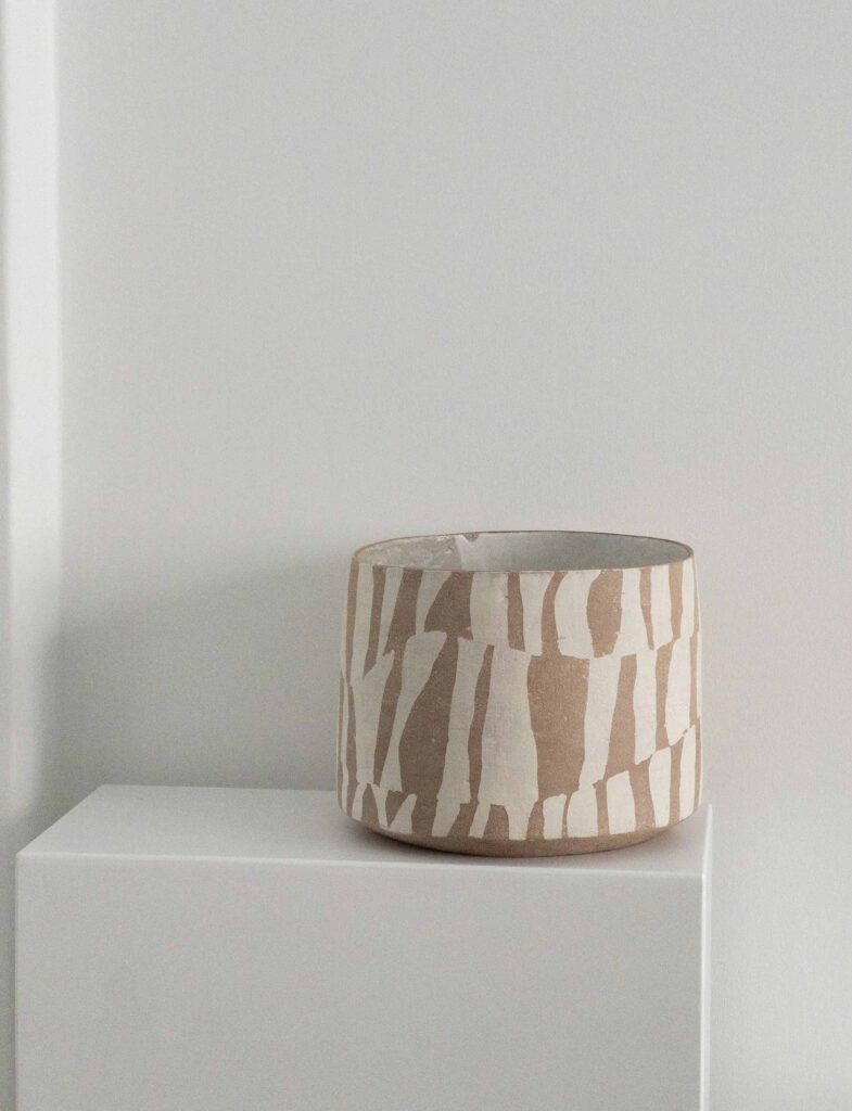 Plant pot <em>Soren</em>, brown and white, 2024. Stoneware, glazed inside, various sizes.
