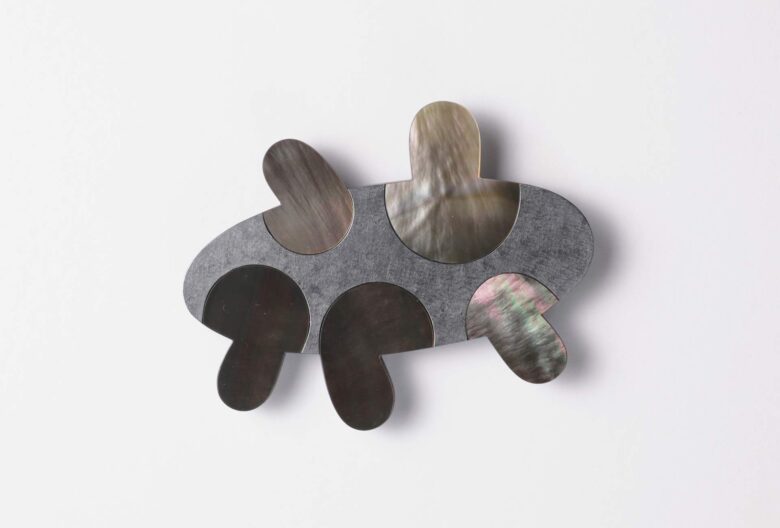 Sabine Steinhäusler, <em>Metamorphosis</em> brooch, 2026. Silver, mother-of-pearl. Photo by Paul Müller.